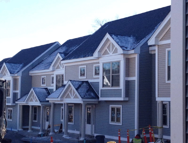 New suburban homes with triangular roofs