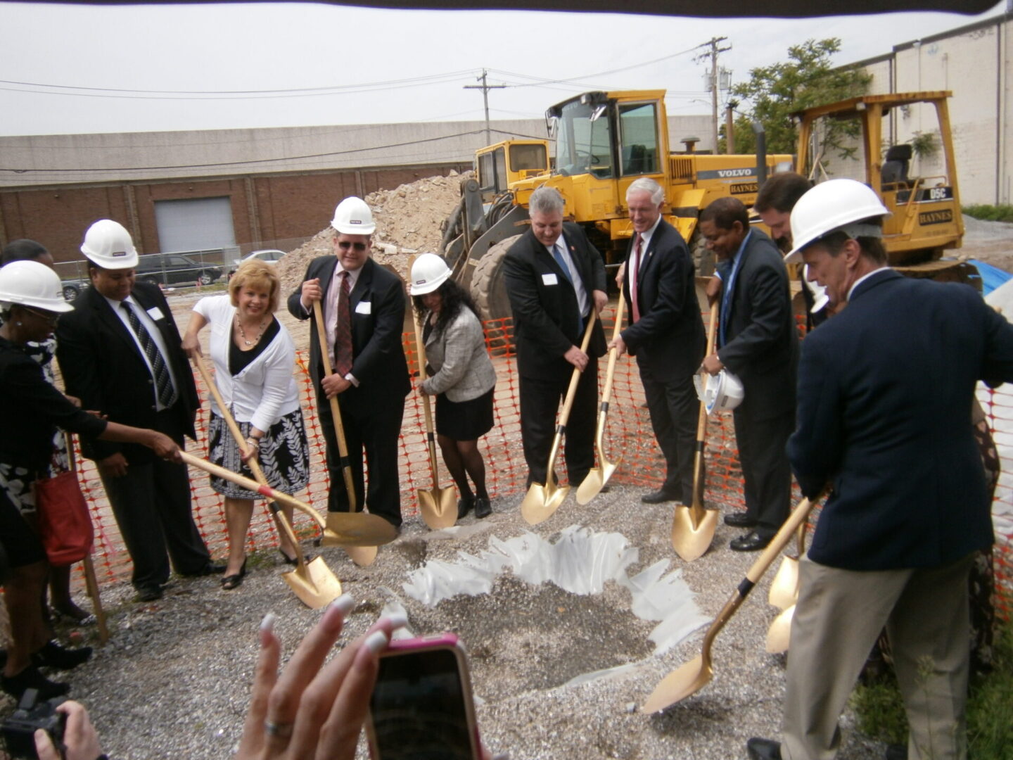 People with shovels at groundbreaking event
