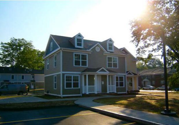 Two-story house under a bright sun